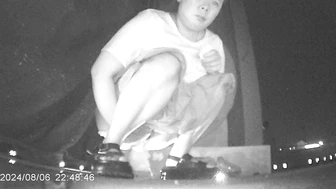 Desperate Chinese girl peeing in a hidden corner of a night market with no toilet