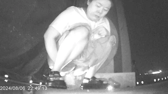 Desperate Chinese girl peeing in a hidden corner of a night market with no toilet